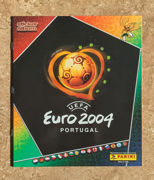 Sticker album for UEFA Euro 2004 Portugal with colorful design and Panini logo.